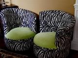 Funky Sofa of California "Garbo" Chairs. Two Black and white Cheetah chairs with Lime green seat.