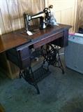                  Singer sewing machine in cabinet