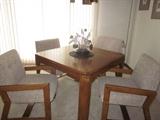 Game table with 4 chairs, table has extra leaf