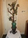 Tree with lights -vase is sitting on Asian looking cast iron base!!