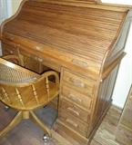 Come take a LOOK  Oak Roll top large desk., office supplies, etc.