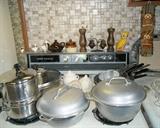 1940s Century Silver Seal hammered aluminum dutch ovens and pots/pans including Farberware and 1960s Revere Copper Clad. 