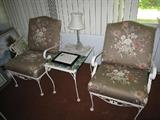 two chairs and wrought iron table