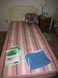 One of the 2 old Sealy twin beds. Mattresses are clean and were also tripled protected! Old but comfortable
