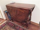 Elegant Gate Leg table by Theodore Alexander.  Closed 15" wide; extends to full 59" to seat group.  Superb quality and condition with turned legs and flame Mahogany. *CERTIFIED BARGAIN