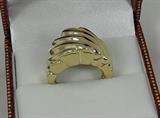 This is our medium flat dome ladies' ring made in 14 karat yellow gold. We make this ring, from the wax model, casting in molten gold, and finishing it ourselves here in Texas. It has a nice weight of 8.2 grams. Great design, good weight, great value. Size six.
