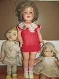 Ideal Composition Shirley Temple doll and old cloth dolls.
