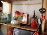 oil lamps, jug, TV among other things in the garage