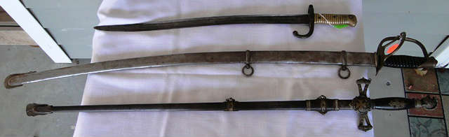 Vintage swords - prices available at sale.