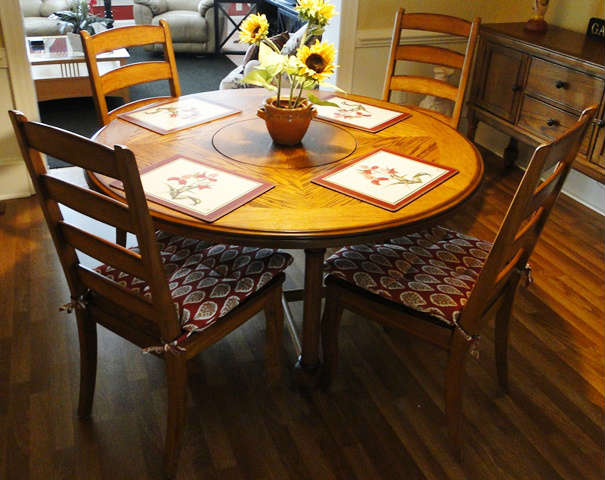 Solid wood dining table / 4 chairs with built in lazy susan $ 600.00