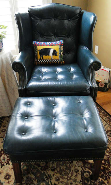 Tack leather wingback chair $ 300 - Leather ottoman $ 100.00
