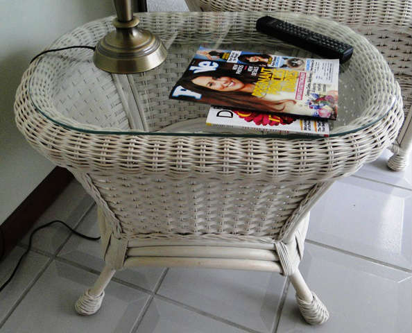 Wicker glass top end table. $ 40.00