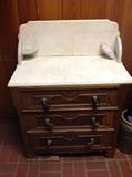 Marble top table with marble splashback - one shelf on right corner top needs to be repaired and one caster (front right) missing.  $ 260.00.  30" wide x 17" deep x 38" tall (to back of splashback)
