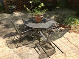 Outdoor metal table / 4 chairs $ 180.00