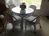 Rattan glass top table - 4 chair set $ 200.00 (chairs need re-upholstering)