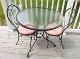Glass top bistro table / 2 chairs $ 100.00