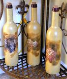 Item # K6 - 3 decorative wine bottles - $ 20.00 for all three.