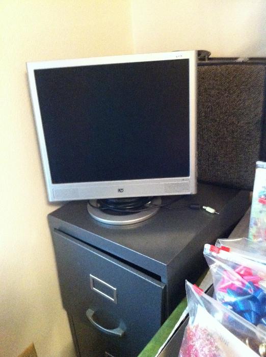            Another filing cabinet; computer monitor