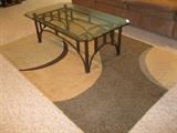 glass top cocktail table and rug