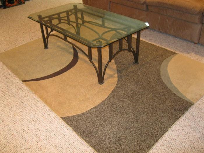glass top cocktail table and rug