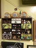 Wonderful wall display mishmash of old, small things. This one includes old Girl Scout badges, jewelry, thimbles and more!