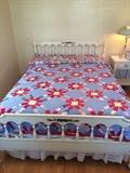 Dixie Furniture full bed with two handmade quilts.