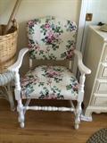 Antique chair painted white enamel and floral upholstery.