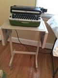 Vintage typing table, pad and typewriter.