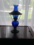 Gorgeous blue glass and black oil lamp. Absolutely beautiful!