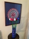 Beautiful glass flowers, framed red, white and blue crochet.