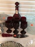 Fun Avon bubble bath wine decanter with six small wine glasses. Also, matching cake knife.