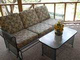 Wrought iron glider and coffee table