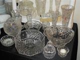 Many pieces of crystal and vintage glassware