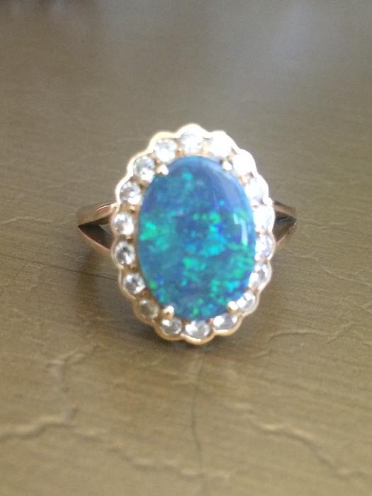 Beautiful opal ring with surround diamonds