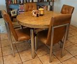 Modern table has leaf and 6 chairs