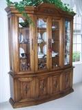 Lighted 3 sectioned china cabinet...lighting for each section can be turned on or off individually