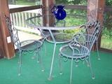 Vintage Patio Set $100, included 5 chairs..(5th not shown)...true color in pics of chairs outside....this shot was washed out by the flash...glass top and middle was replaced...dates back to the 1940's...in great shape!