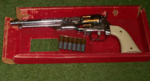 Vintage cap gun with bullets in orginal box.