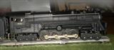 Early 1950's Lionel Engine, fine condition, smoke stack smokes with steam, several cars, all with orginal boxes, track and transformer.