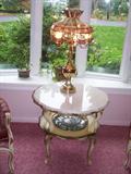 Leaded glass and brass lamp, marble table.