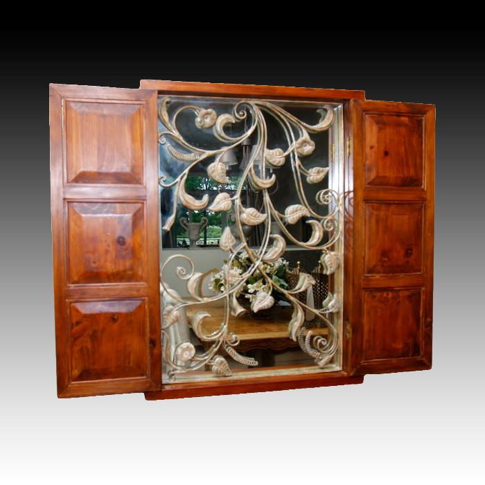 T_62.JPG	Wood, Metal and mirror wall cabinet. Solid wood closed doors open to a mirror covered in wrought metal filigree
Condition: Very Good
Shipping: Yes
Size: 40" x 30" x 4" 