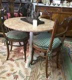 Marble top table; antique carved sidechairs