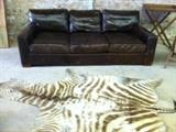 Restoration Hardware Luxe leather sofa - zebra rug 