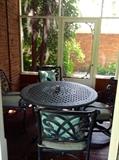 Round metal table with 4 chairs