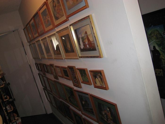 An entire wall of Disney framed art.