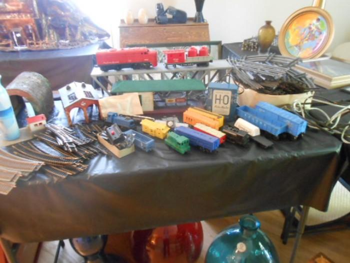 Ho and Lionel trains, metal for the most a few plastic cars, plenty of track and odds and ends