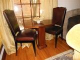 Set of Four French Art Deco Leather Side Chairs with a French Art Deco Geometric Tea Table w/ a Mother-of-Pearl Insert.