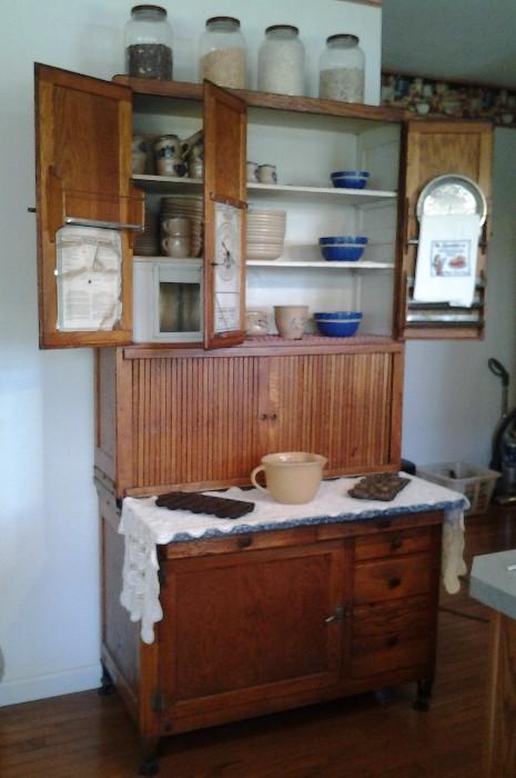 Amazing Original Hoosier Cabinet with Original Hardware, Original Sifters, and Menu Chart dated 1915.