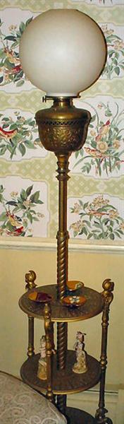 Victorian Bradley & Hubbard Piano Lamp with 3 Shelf Attached Table, made of Brass, has Putti Soldier Accents, marked B & H, stands 66" Tall