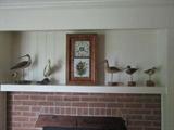 clock and wood duck figurines
